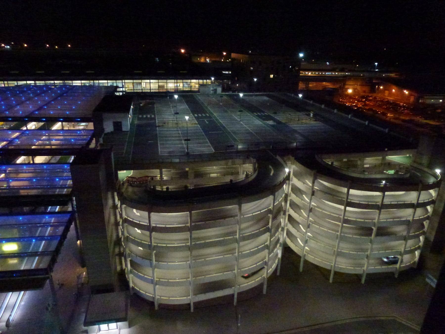 Multi-storey North Terminal parking at Gatwick Airport, lit at night